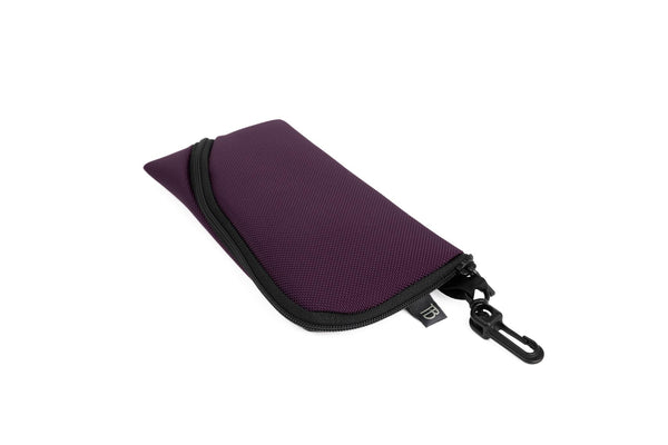 A Small Ghost Whale Pouch in Aubergine (dark purple).